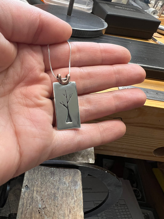 Sapling Tree Pendant one-of-a-kind – close-up of handcrafted sterling silver oxidized sapling tree pendant showing branch and leaf detail, black background
