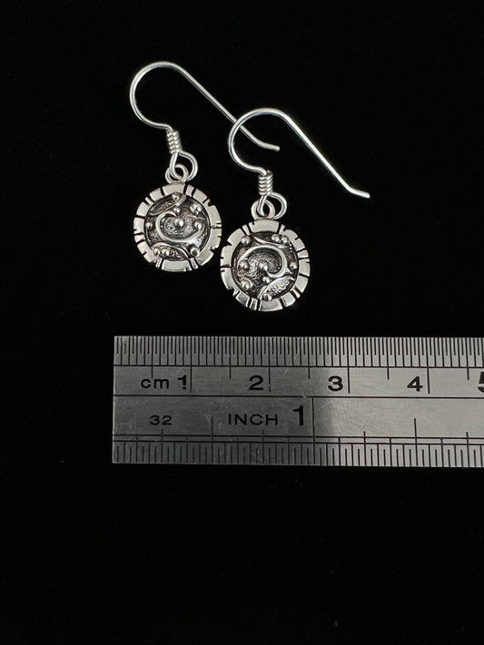 Artisanal Elements Earrings – close-up of sterling silver artisanal elements disc drop earrings showing mixed-metal oxidized texture detail, black background