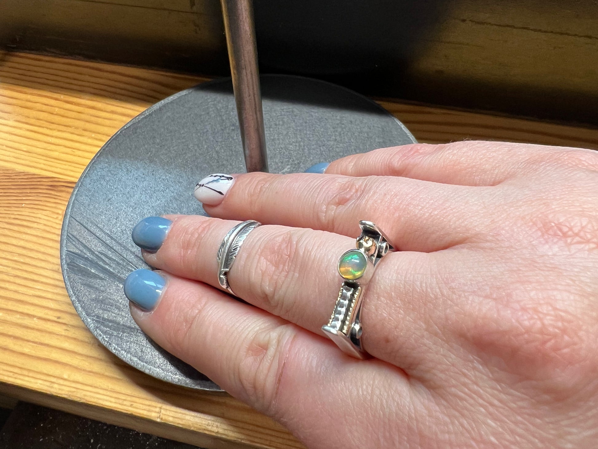 Sterling Silver Bar Ring with Opal and Yellow Gold Accents – size reference showing sterling silver bar ring with opal and yellow gold accents next to ruler, black background