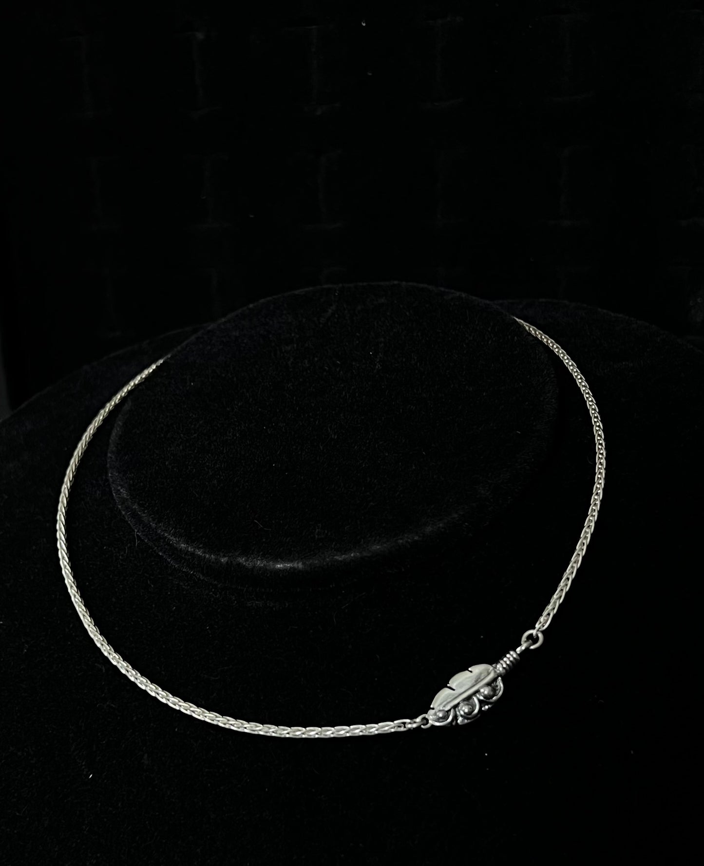 Embedded Feather Necklace – front view of handcrafted sterling silver embedded feather resin pendant necklace, black background