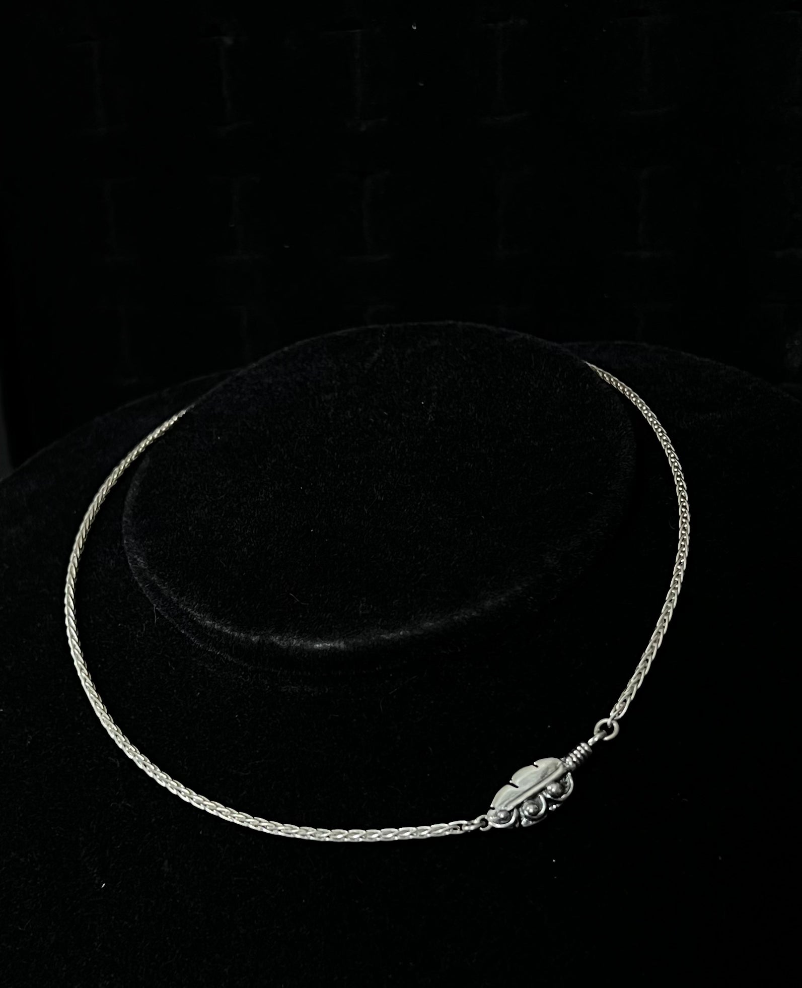 Embedded Feather Necklace – front view of handcrafted sterling silver embedded feather resin pendant necklace, black background