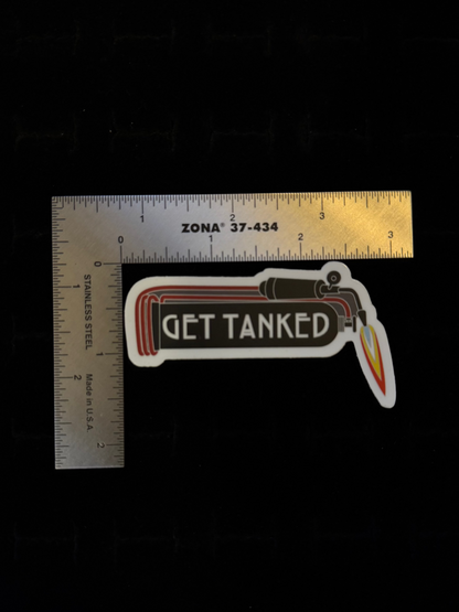 Get Tanked sticker – lifestyle shot of white die-cut sticker from The Tiny Smithery applied to surface