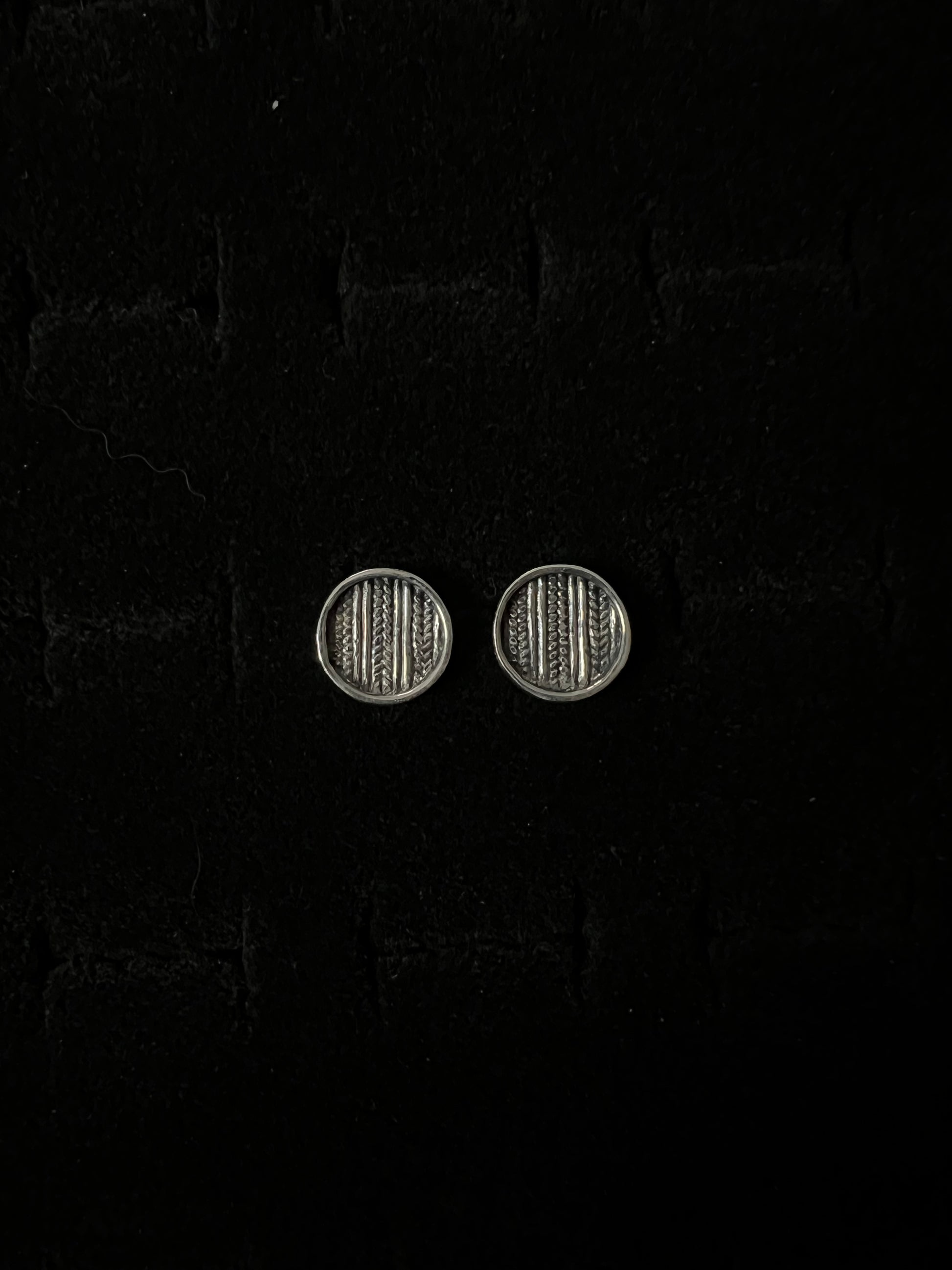Medium Sweater Post Earrings – pair of handcrafted sterling silver round disc stud earrings with knit-texture pattern, black velvet background