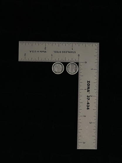 Medium Sweater Post Earrings – size reference showing sterling silver knit-texture disc stud earrings approximately half inch wide next to ruler, black background