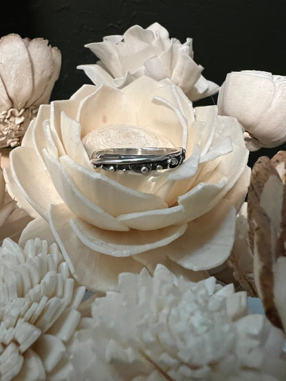 Narrow Feather Ring – size reference showing sterling silver narrow feather band ring next to ruler, black background