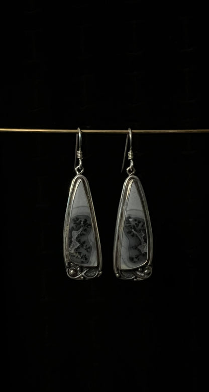 One-Of-A-Kind Artisanal Earrings – unique handcrafted sterling silver mixed-metal drop earrings with oxidized texture and gemstone detail, black background