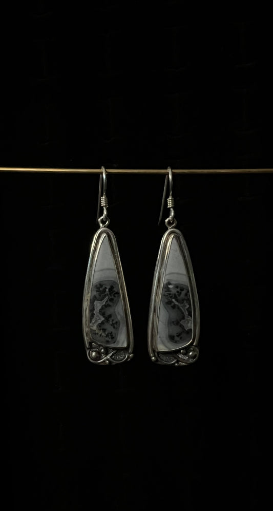 One-Of-A-Kind Artisanal Earrings – unique handcrafted sterling silver mixed-metal drop earrings with oxidized texture and gemstone detail, black background