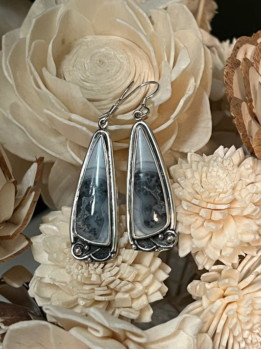 One-Of-A-Kind Artisanal Earrings – close-up of handcrafted sterling silver one-of-a-kind artisanal drop earrings with texture detail, black backgroun