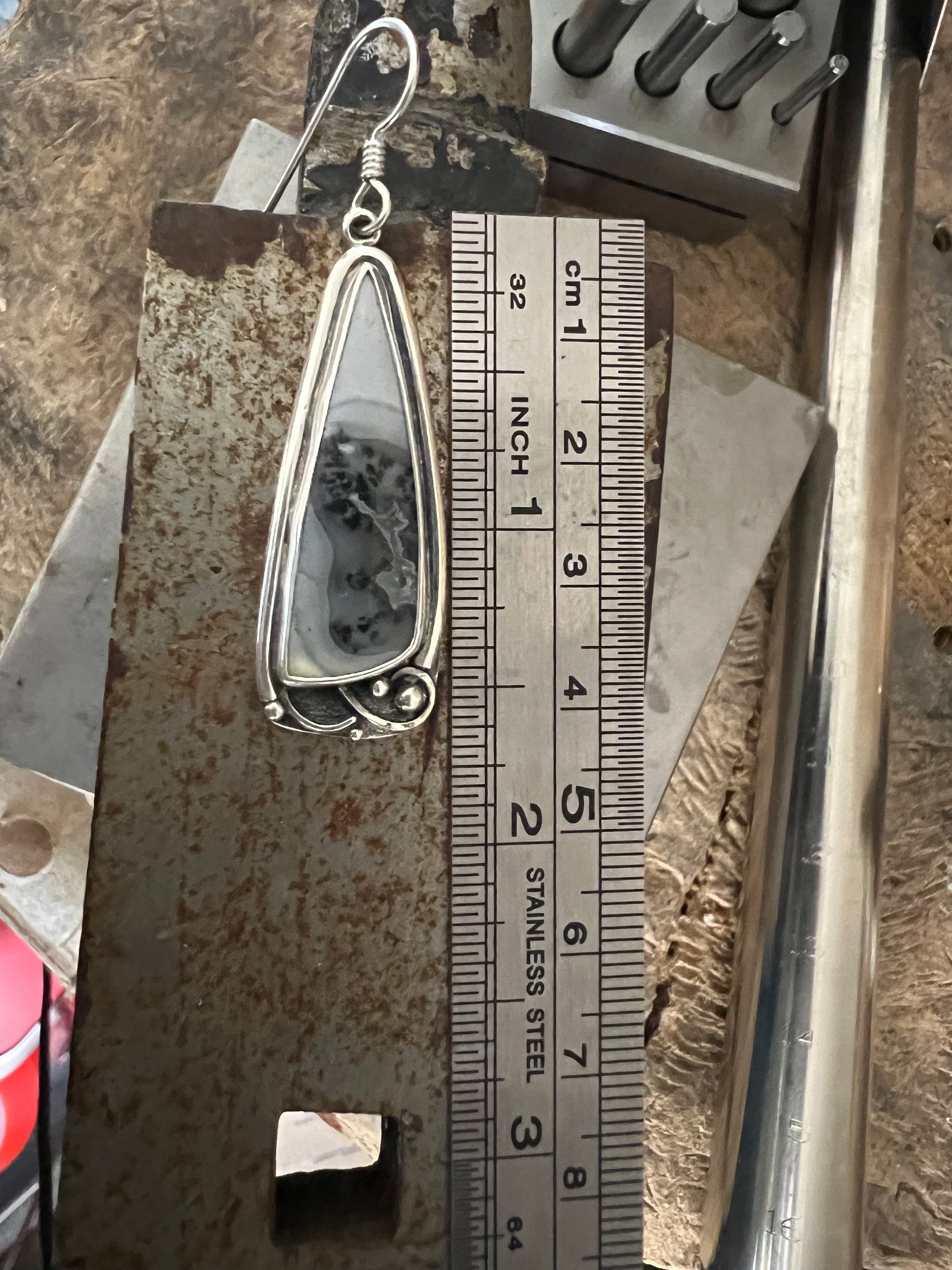 One-Of-A-Kind Artisanal Earrings – size reference showing handcrafted sterling silver one-of-a-kind artisanal earrings next to ruler, black background