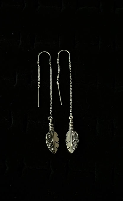 Petite Feather Threaders – front view of handcrafted sterling silver petite feather threader earrings, black background