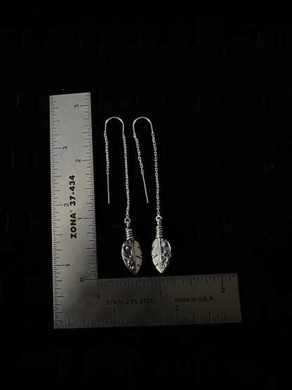 Petite Feather Threaders – size reference showing sterling silver petite feather threader earrings approximately 2 inches long next to ruler, black background