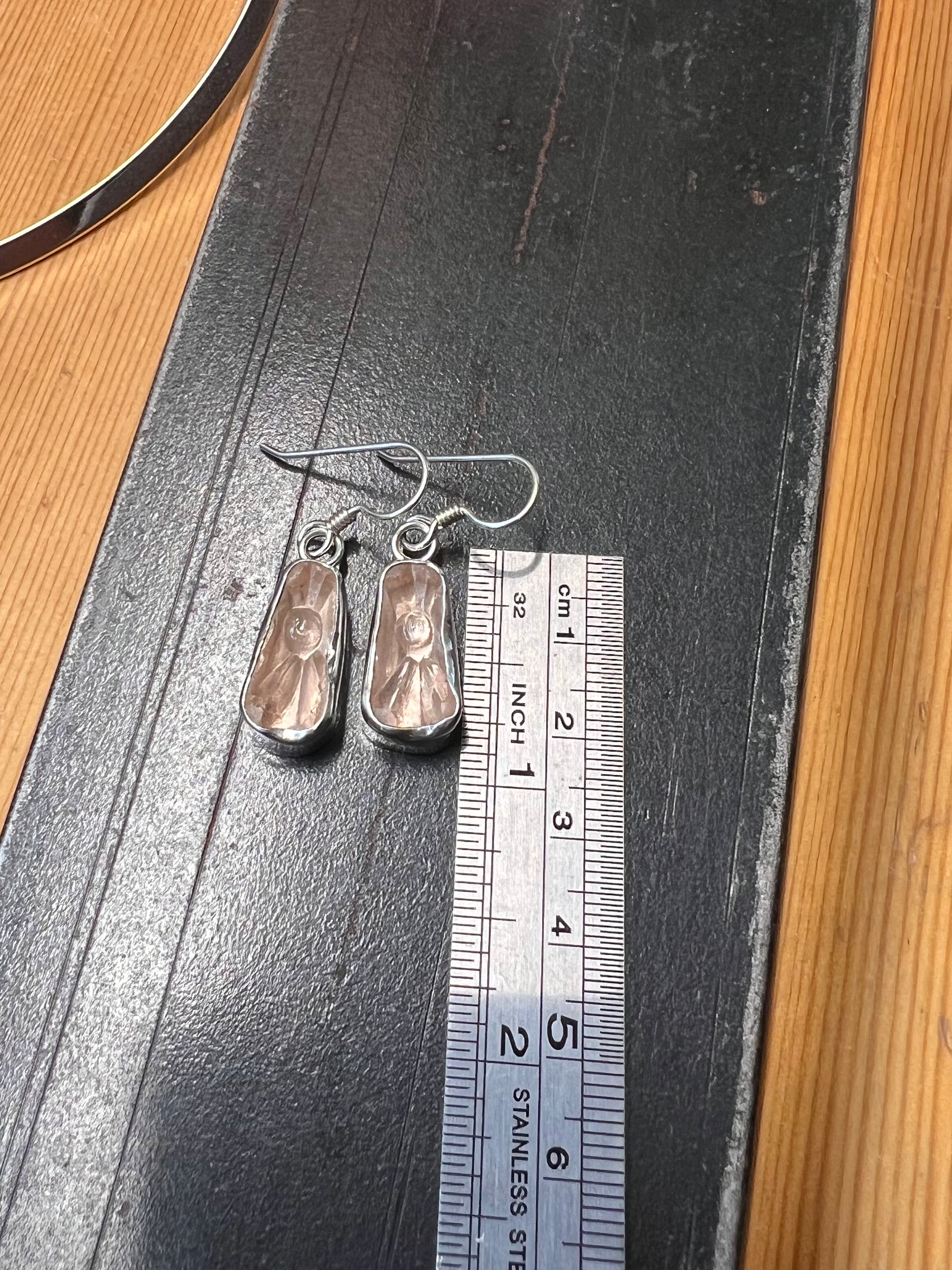 Vintage Glass Earrings – close-up of sterling silver bezel-set vintage glass cabochon drop earrings showing stone detail, black backgroun