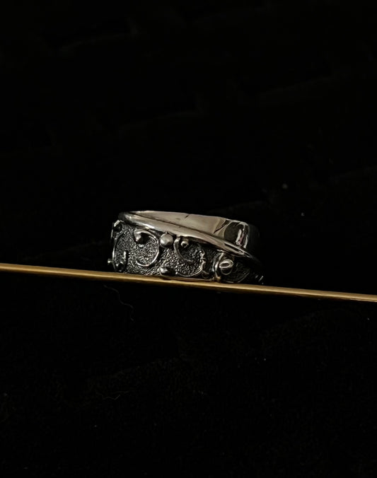 Wide Feather Ring – handcrafted sterling silver wide band ring with oxidized feather texture pattern, black background