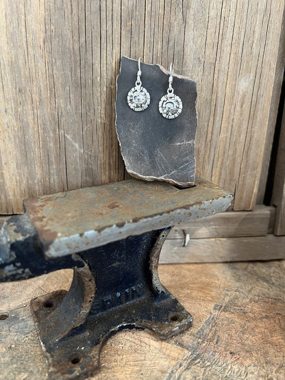 Artisanal Elements Earrings – lifestyle shot of sterling silver artisanal elements disc drop earrings, natural light